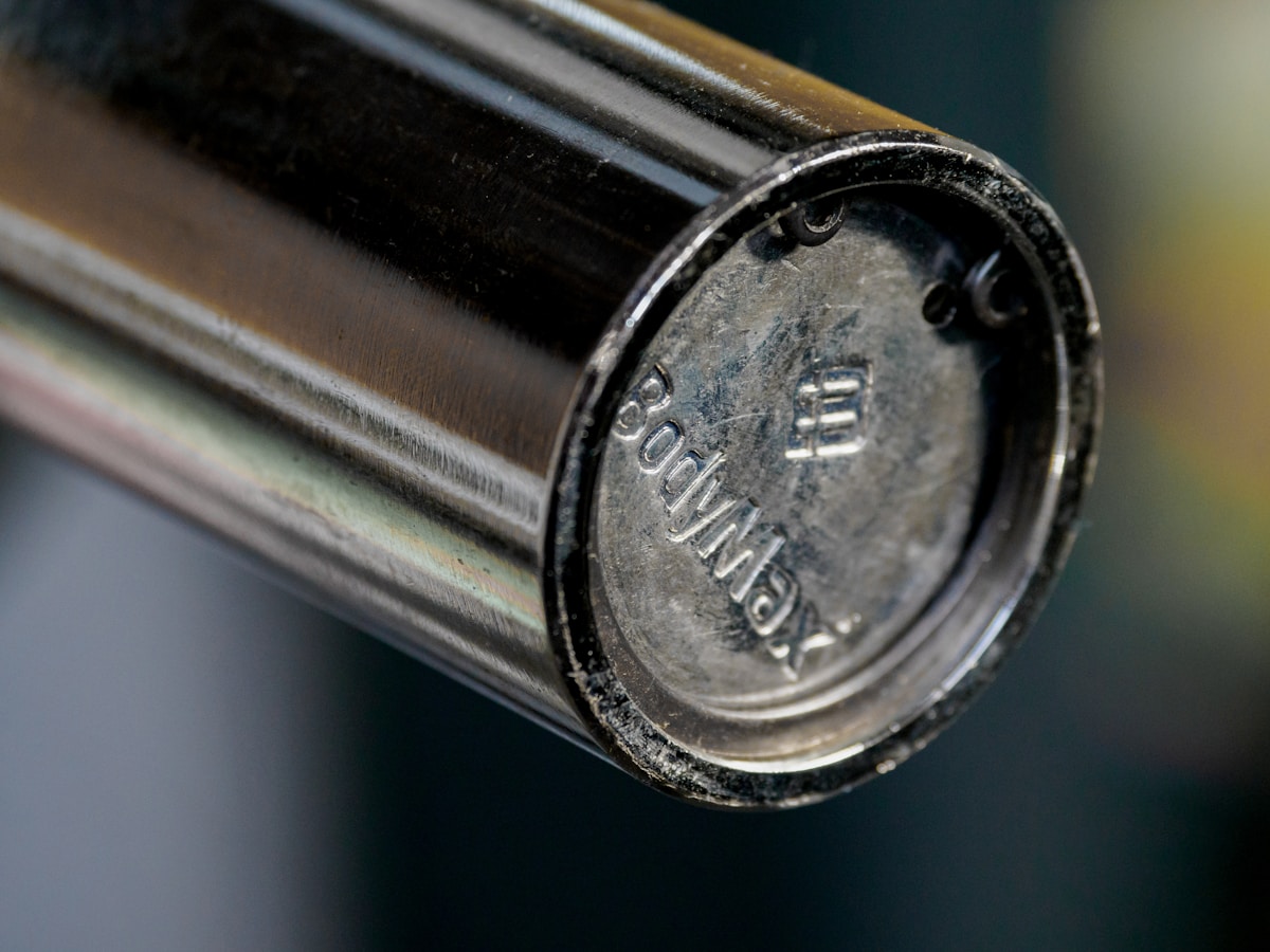 silver round coin in close up photography